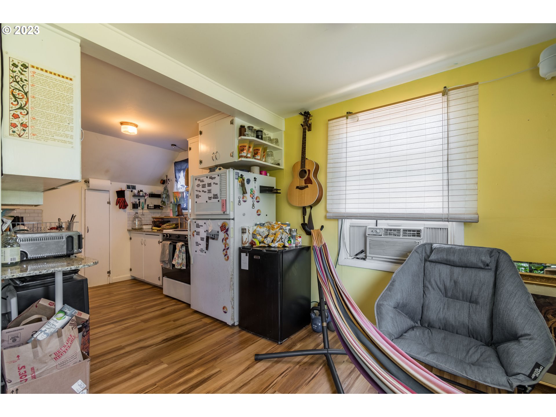 1275 West 5th Avenue Eugene, OR 97402 - Photo 18 of 31 a living room with furniture and a flat screen tv