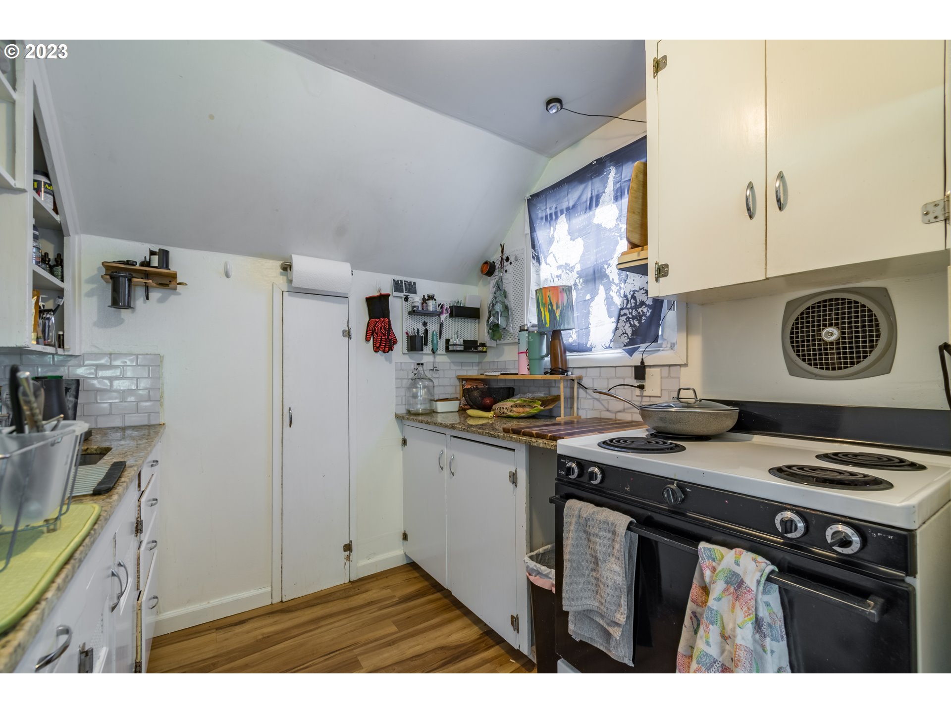 1275 West 5th Avenue Eugene, OR 97402 - Photo 20 of 31 a kitchen with stainless steel appliances granite countertop a stove a refrigerator and a sink