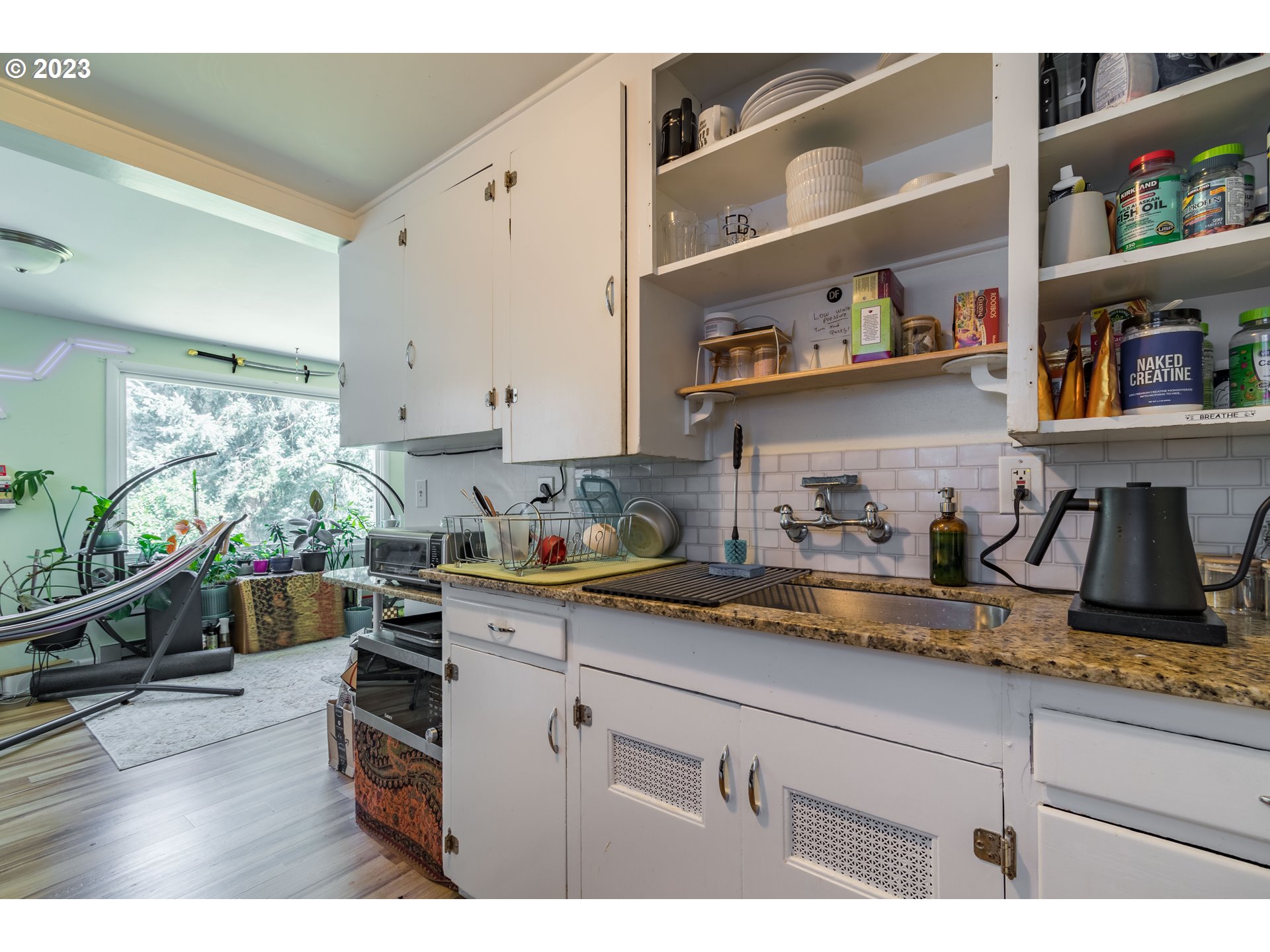 1275 West 5th Avenue Eugene, OR 97402 - Photo 21 of 31 a kitchen with appliances and cabinets