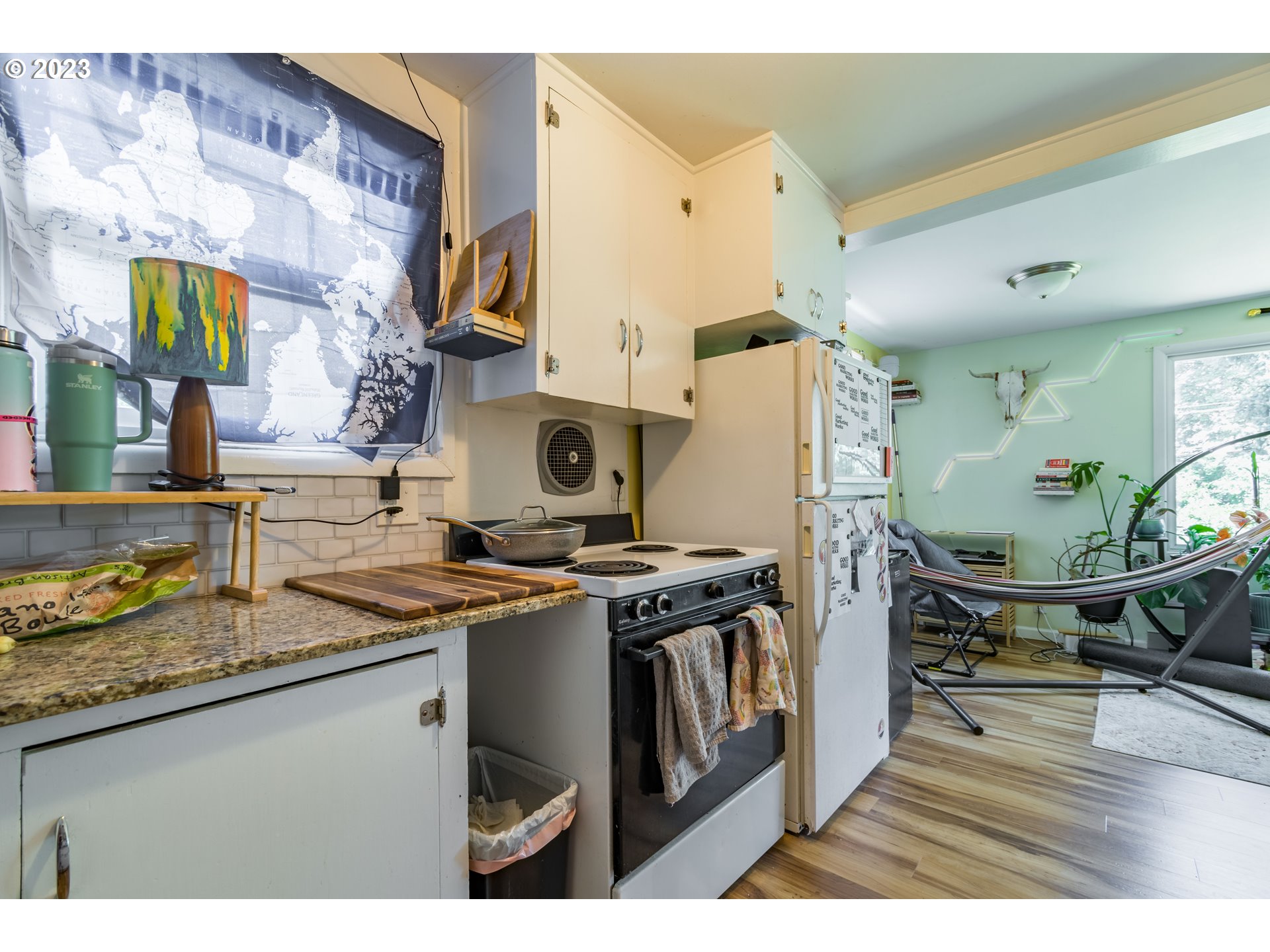 1275 West 5th Avenue Eugene, OR 97402 - Photo 22 of 31 a kitchen with stainless steel appliances granite countertop a sink stove and refrigerator