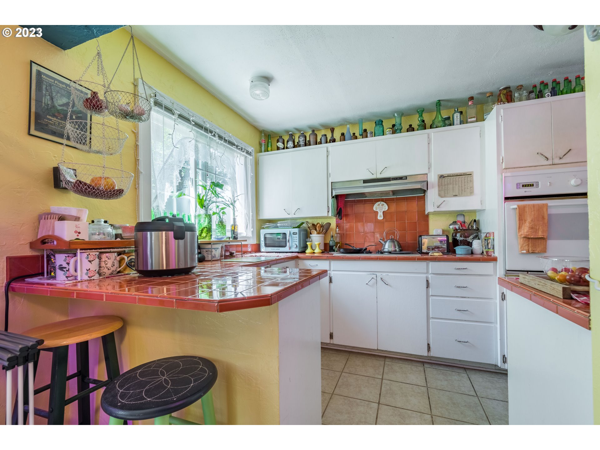 1275 West 5th Avenue Eugene, OR 97402 - Photo 7 of 31 a kitchen with cabinets a sink and appliances