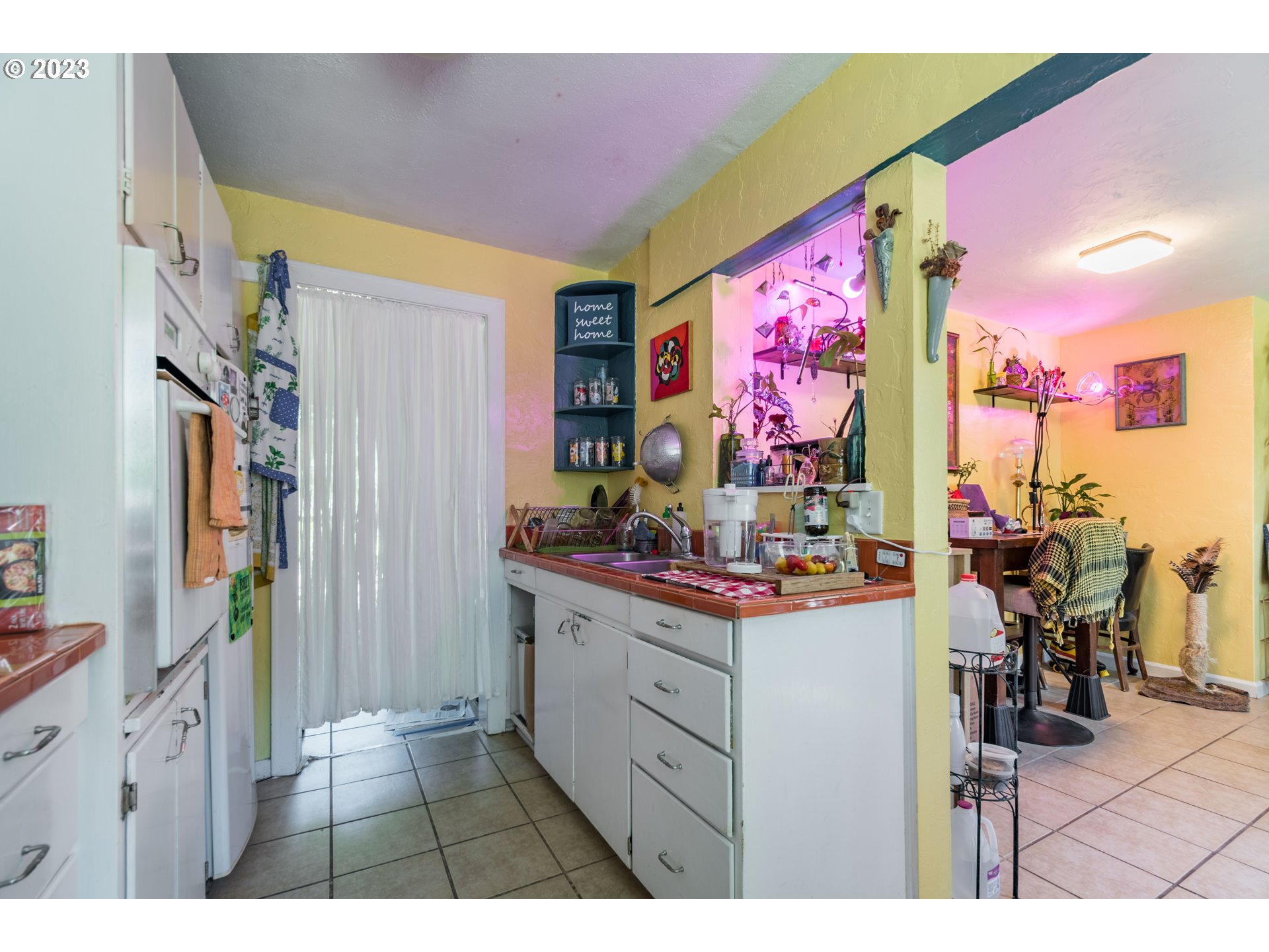 1275 West 5th Avenue Eugene, OR 97402 - Photo 9 of 31 a view of living room with furniture and flat screen tv