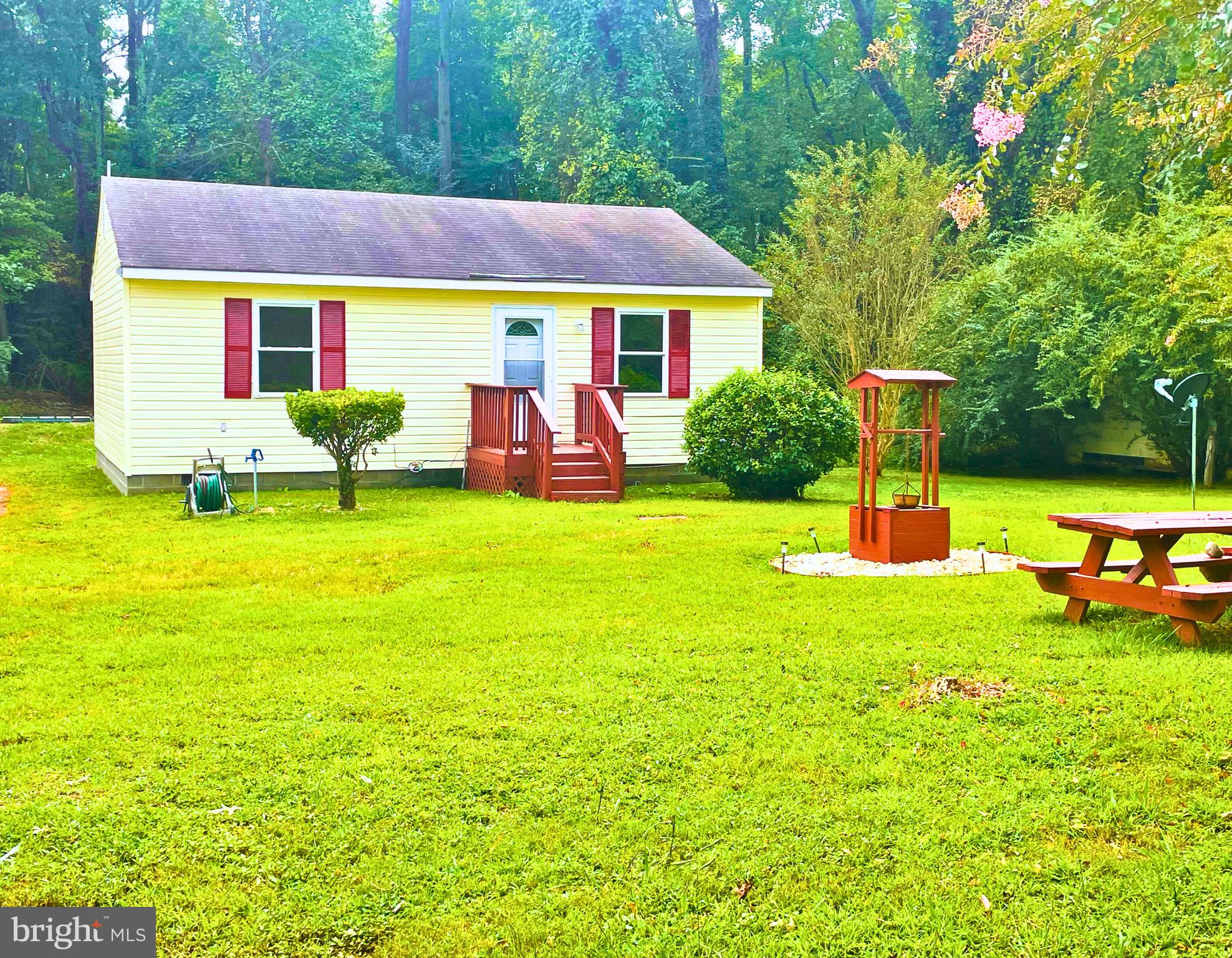 a view of a house with a yard patio and swimming pool