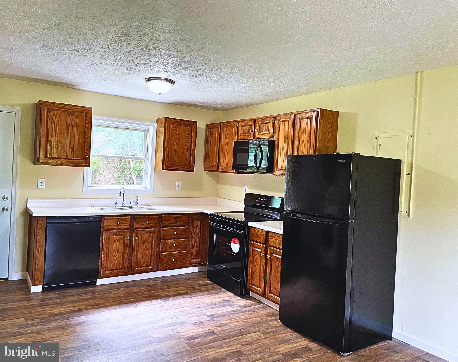 5367 Morattico Road Lancaster, VA 22503 - Photo 2 of 9 a kitchen with stainless steel appliances granite countertop a refrigerator and a sink