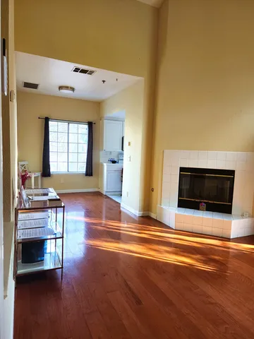 a view of livingroom with furniture wooden floor and window