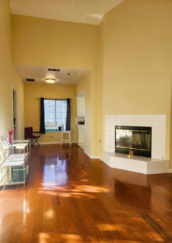 a view of kitchen with furniture and flat screen tv
