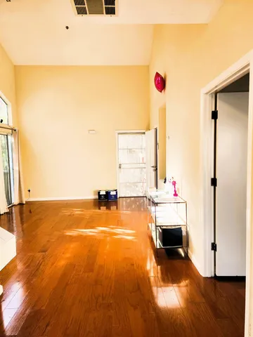 a view of a livingroom with wooden floor