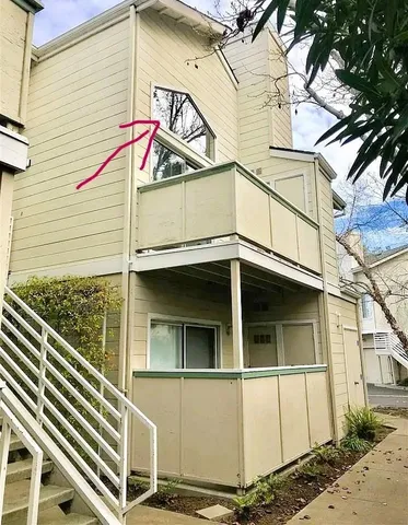 a small white building with a white roof