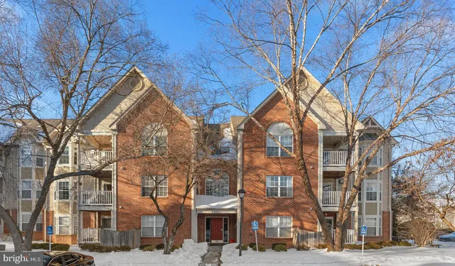 a view of a building with a snow in the background