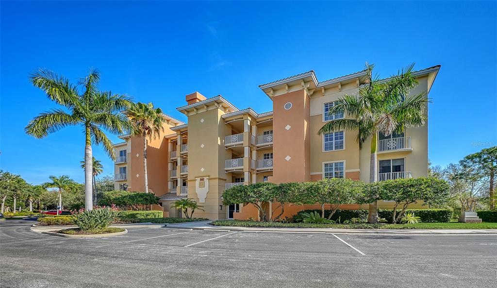 6465 Water Crest Way, Unit 301 Lakewood Ranch, FL 34202 - Photo 1 of 85 a view of a building with a street