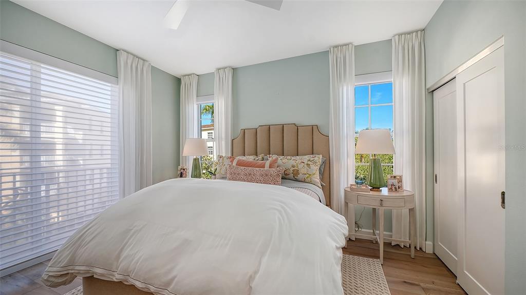 6465 Water Crest Way, Unit 301 Lakewood Ranch, FL 34202 - Photo 35 of 85 a bedroom with a bed and a window