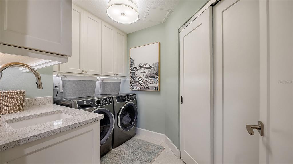6465 Water Crest Way, Unit 301 Lakewood Ranch, FL 34202 - Photo 38 of 85 a utility room with dryer and washer