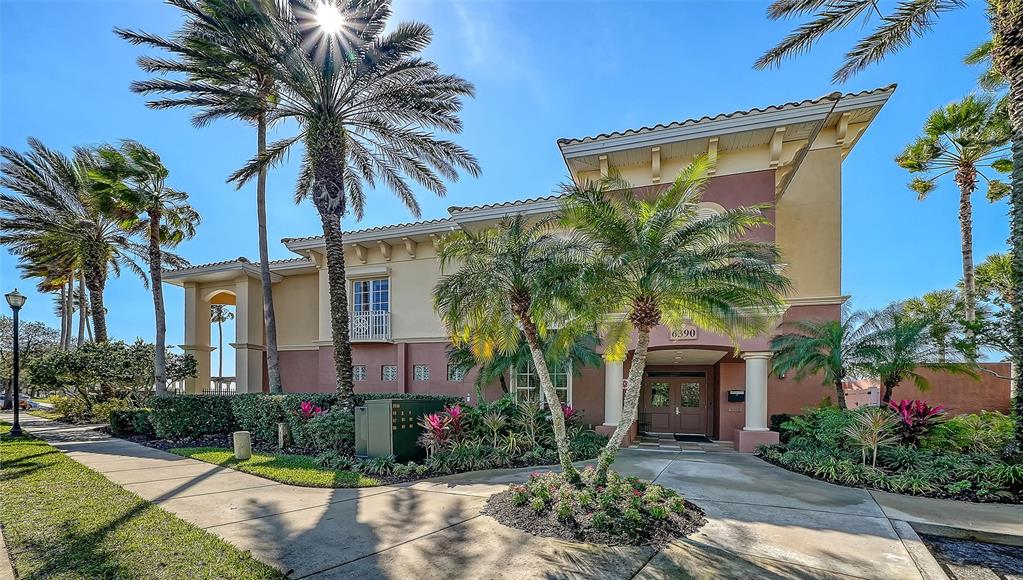 6465 Water Crest Way, Unit 301 Lakewood Ranch, FL 34202 - Photo 45 of 85 a view of a house with a yard and palm trees