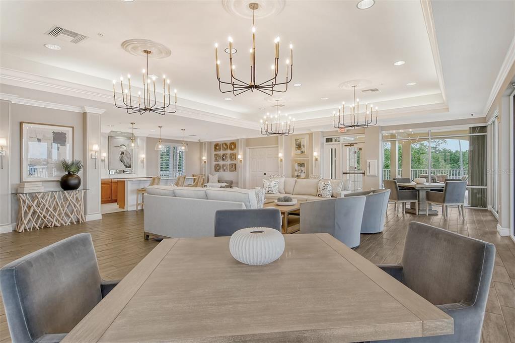 6465 Water Crest Way, Unit 301 Lakewood Ranch, FL 34202 - Photo 56 of 85 a large kitchen with a table and chairs