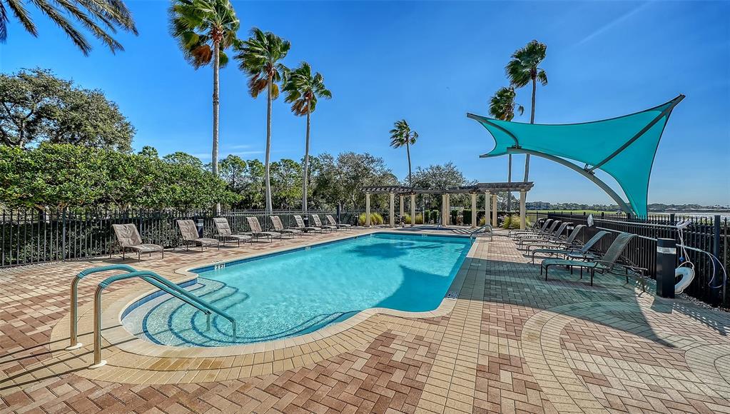 6465 Water Crest Way, Unit 301 Lakewood Ranch, FL 34202 - Photo 65 of 85 a view of a swimming pool with a patio