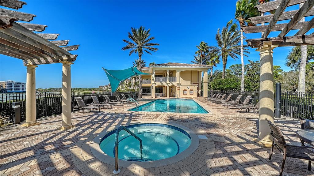 6465 Water Crest Way, Unit 301 Lakewood Ranch, FL 34202 - Photo 72 of 85 a view of a house with pool and sitting area