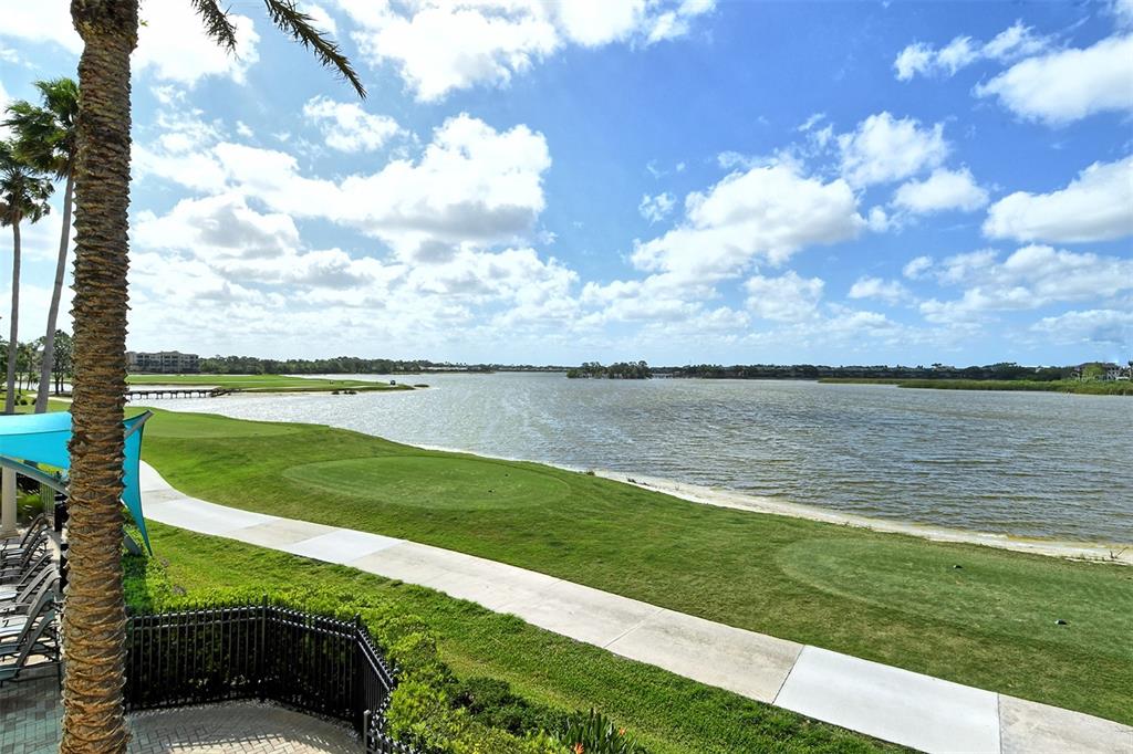 6465 Water Crest Way, Unit 301 Lakewood Ranch, FL 34202 - Photo 77 of 85 a view of a lake with a big yard