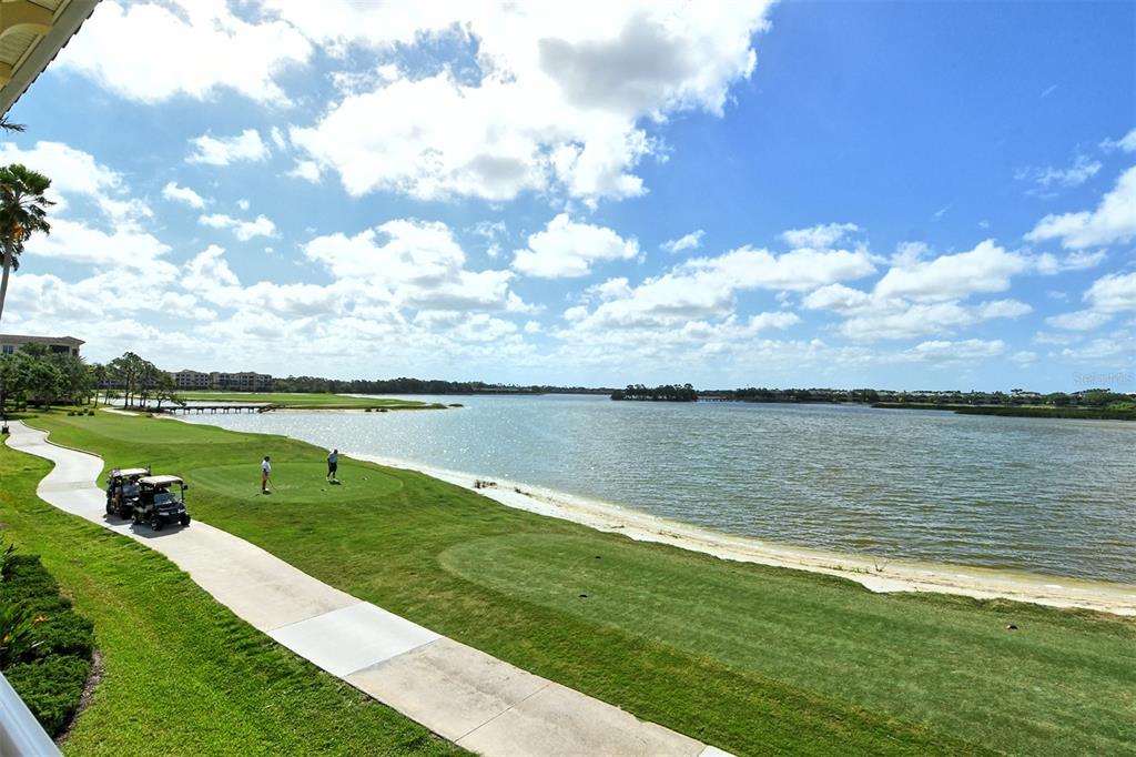 6465 Water Crest Way, Unit 301 Lakewood Ranch, FL 34202 - Photo 79 of 85 a view of a lake from a yard