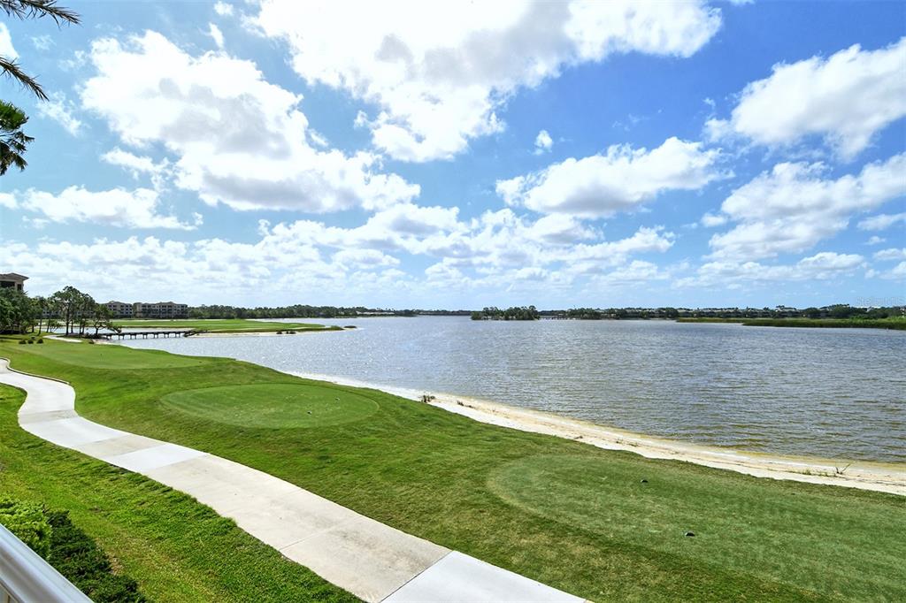 6465 Water Crest Way, Unit 301 Lakewood Ranch, FL 34202 - Photo 81 of 85 a view of a lake from a yard