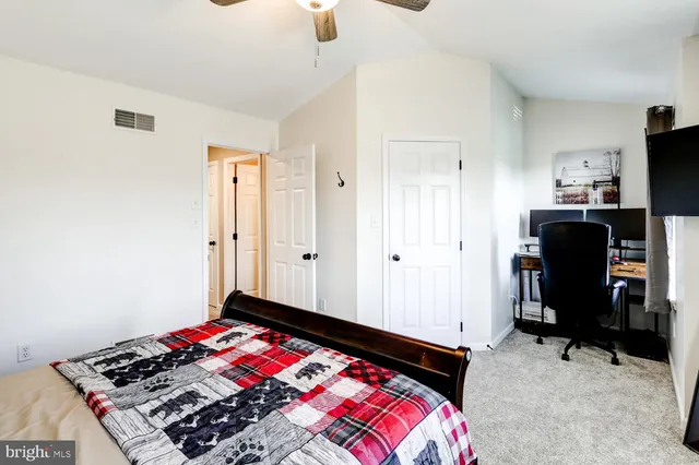 a bathroom with a sink mirror and toilet