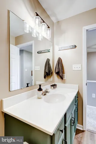 a bedroom with a bed and a view of bathroom