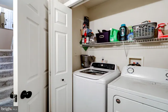 a kitchen with a sink a stove and cabinets