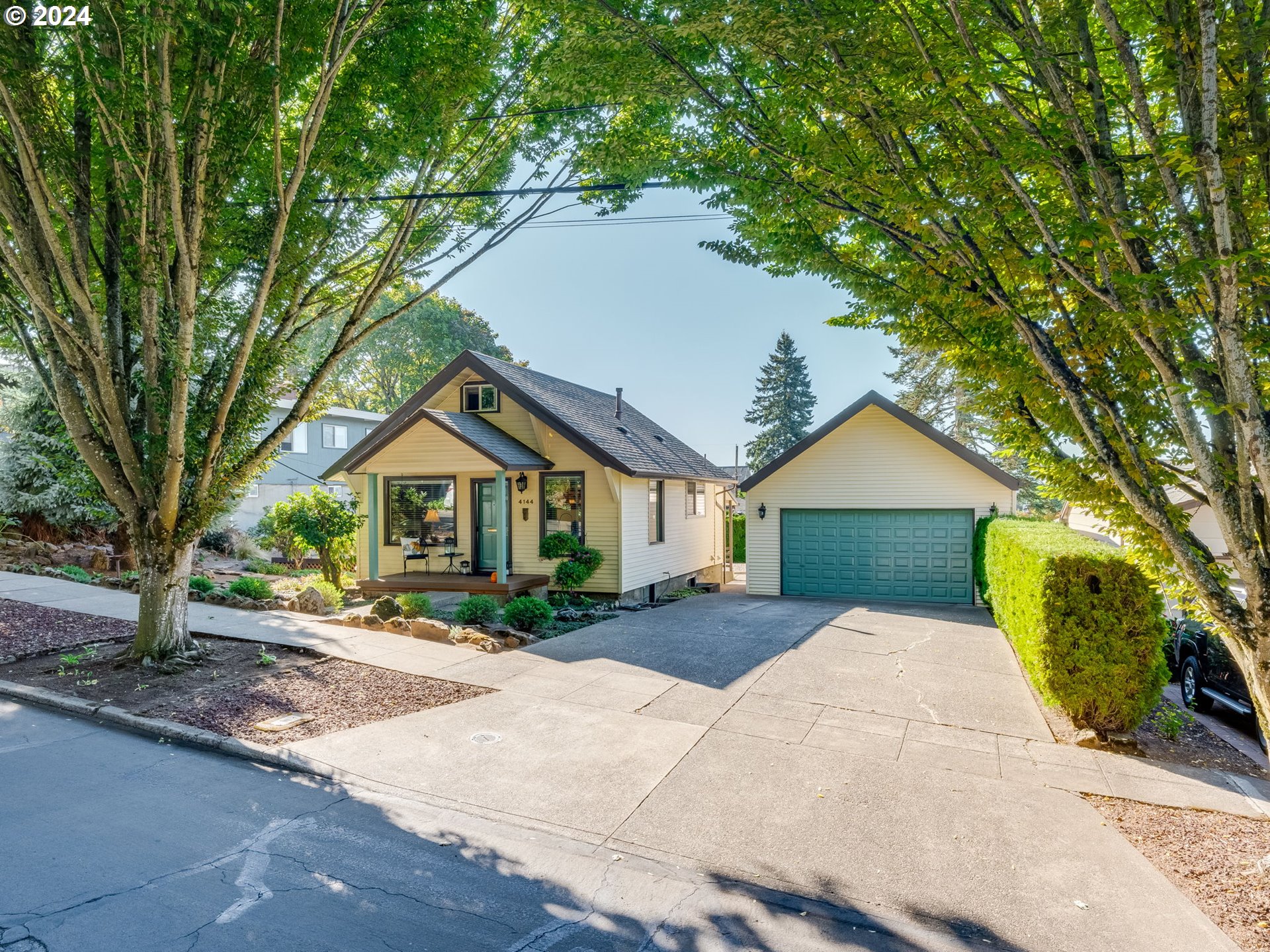 a front view of a house with a yard and an outdoor seating