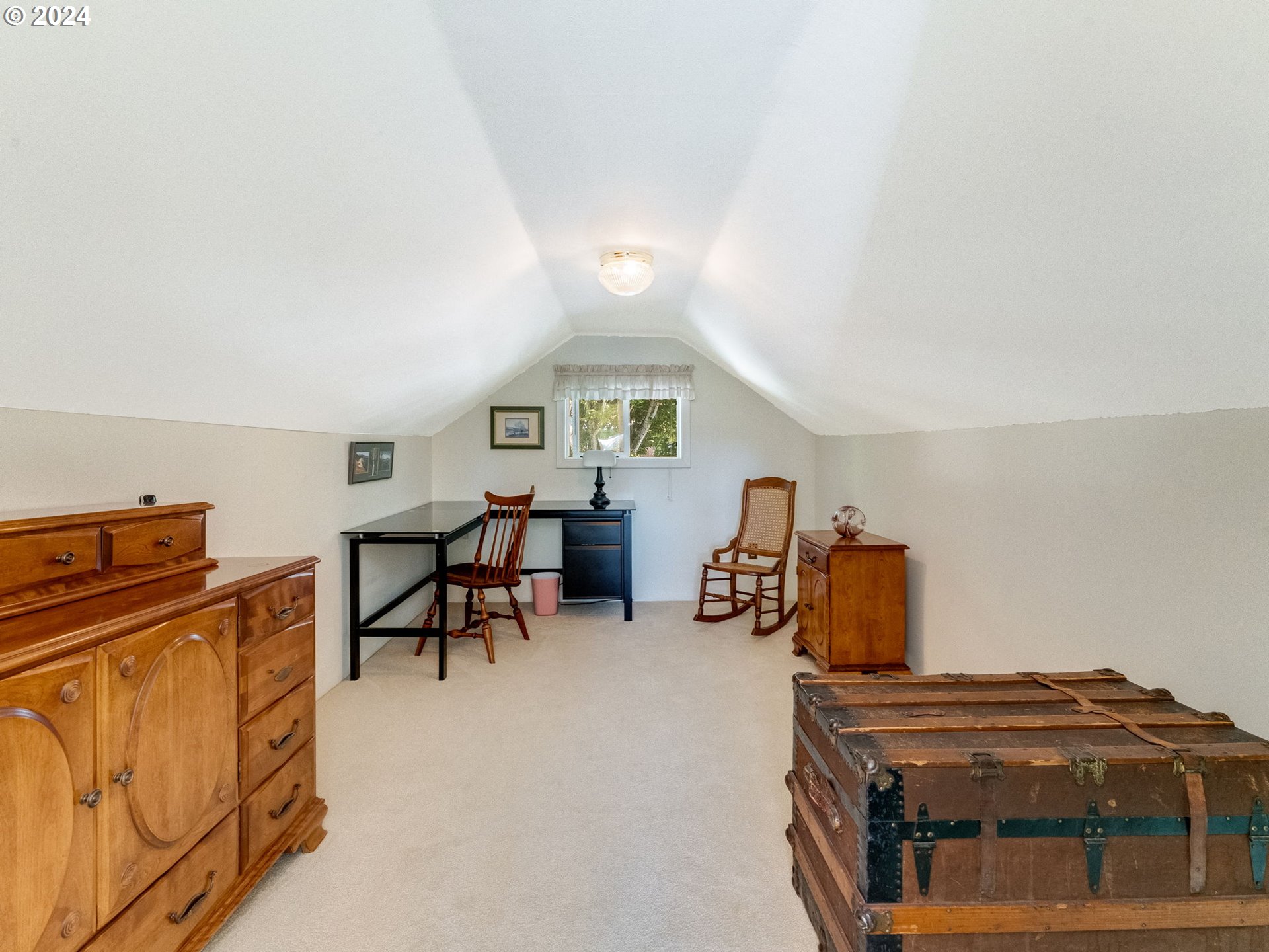 4144 Southeast Ogden Street Portland, OR 97202 - Photo 11 of 27 a bedroom with furniture and a window