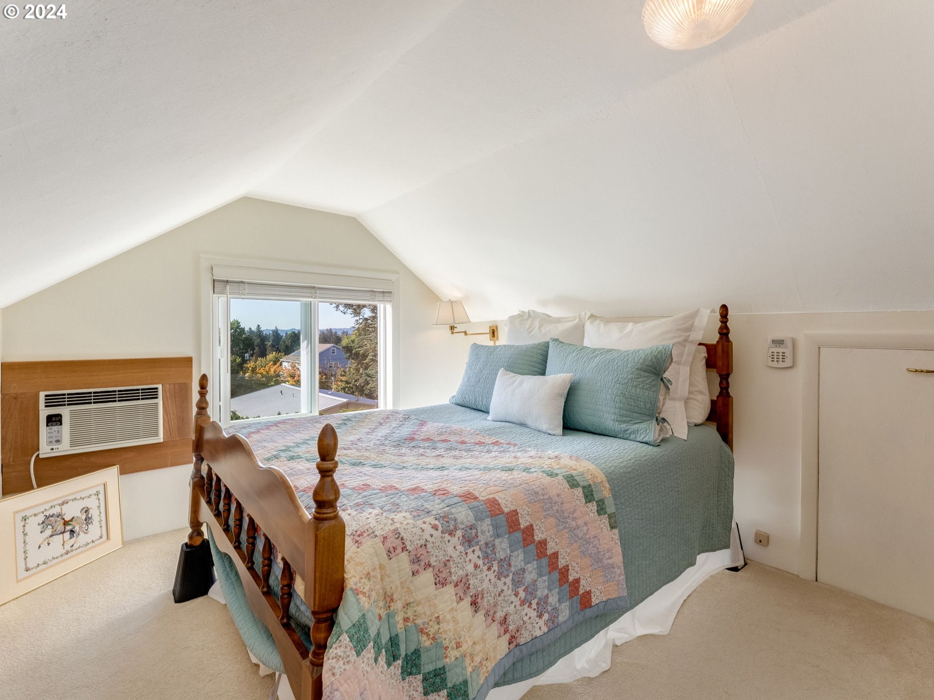 4144 Southeast Ogden Street Portland, OR 97202 - Photo 12 of 27 a bedroom with a bed and a large window