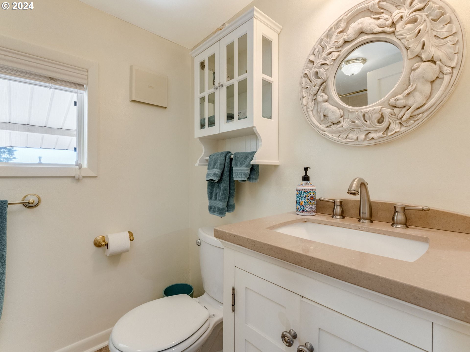 4144 Southeast Ogden Street Portland, OR 97202 - Photo 13 of 27 a bathroom with a toilet and a sink
