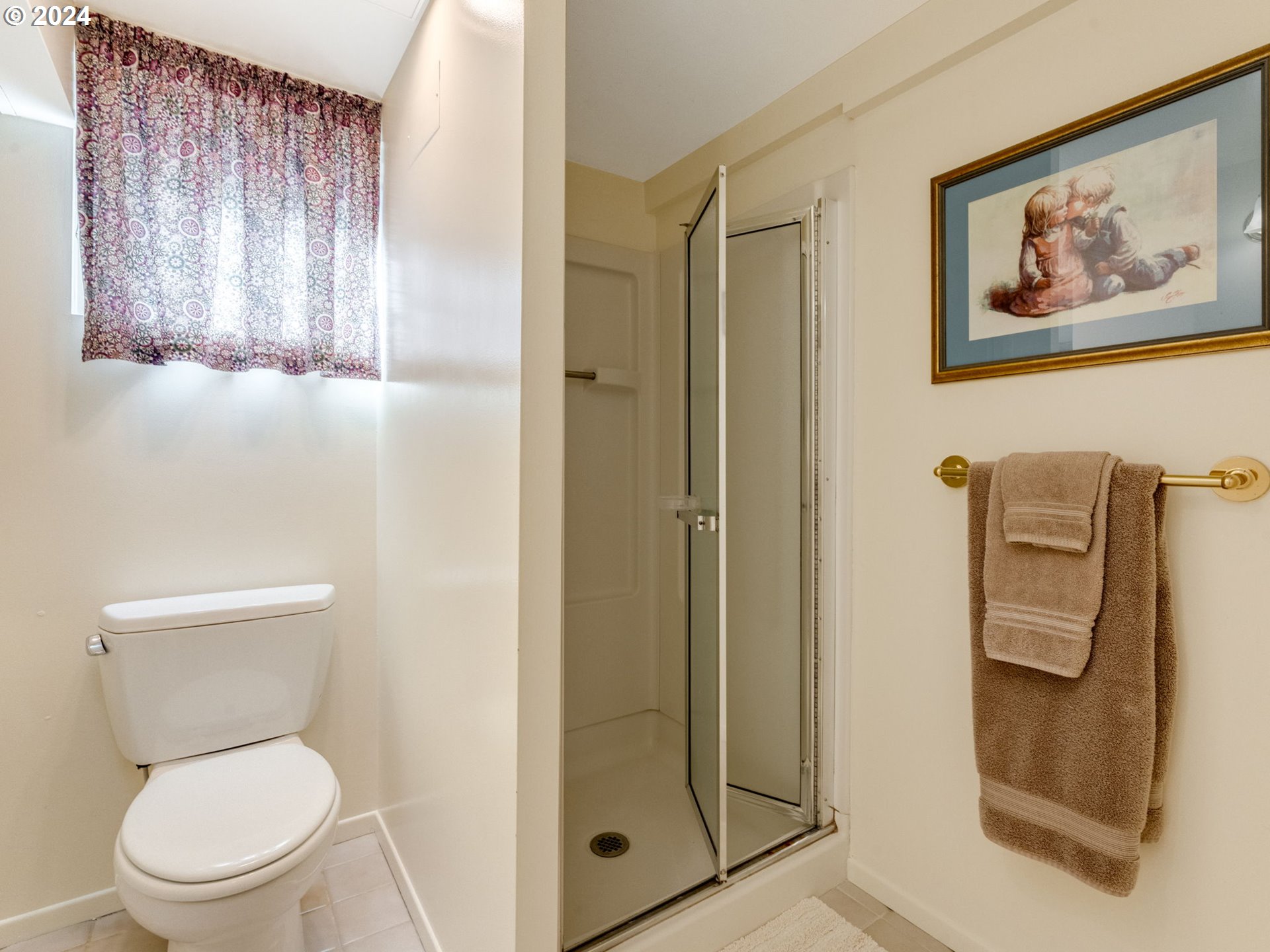 4144 Southeast Ogden Street Portland, OR 97202 - Photo 17 of 27 a white toilet sitting next to a bathroom sink