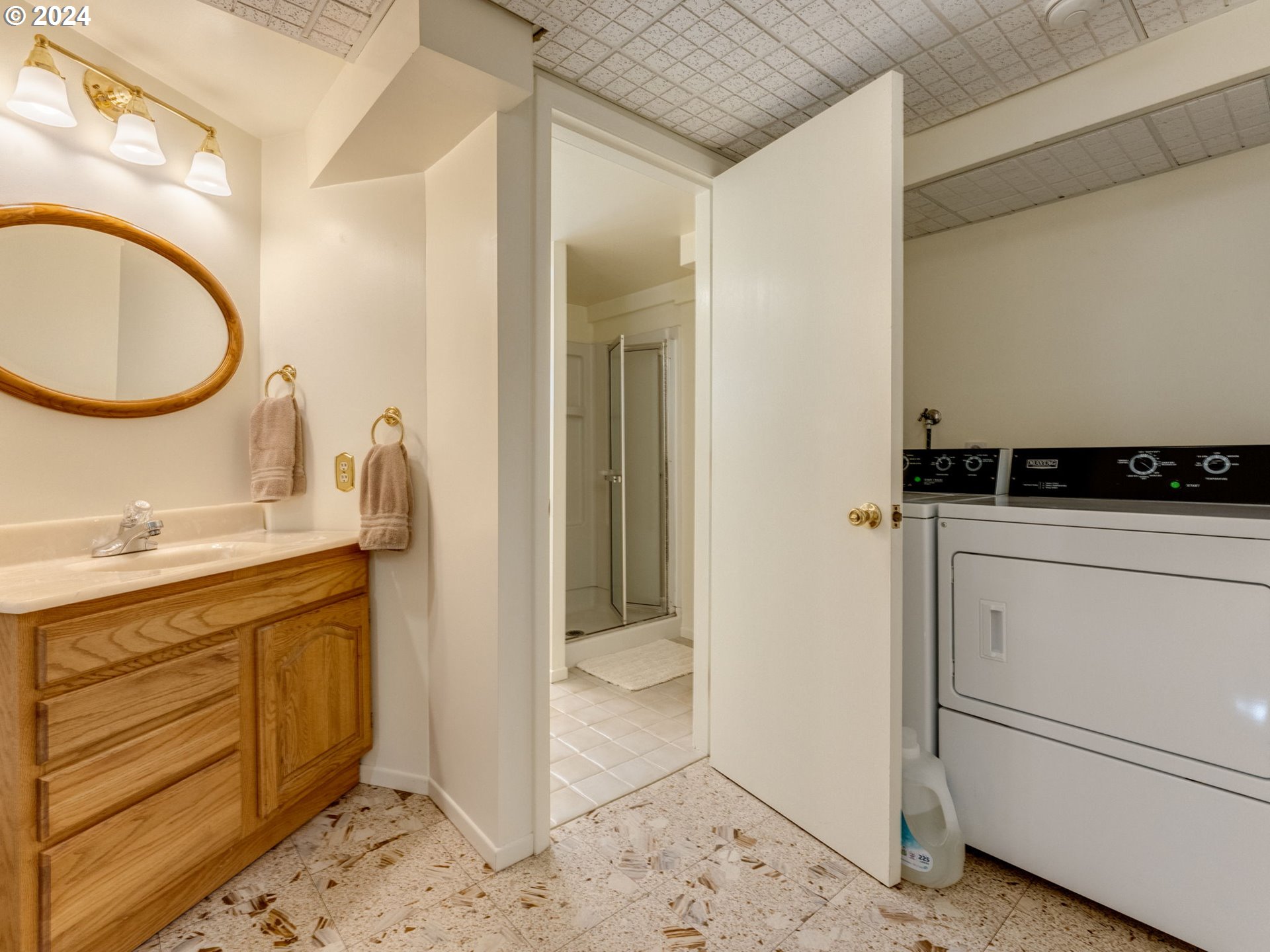 4144 Southeast Ogden Street Portland, OR 97202 - Photo 18 of 27 a bathroom with a granite countertop sink and a mirror