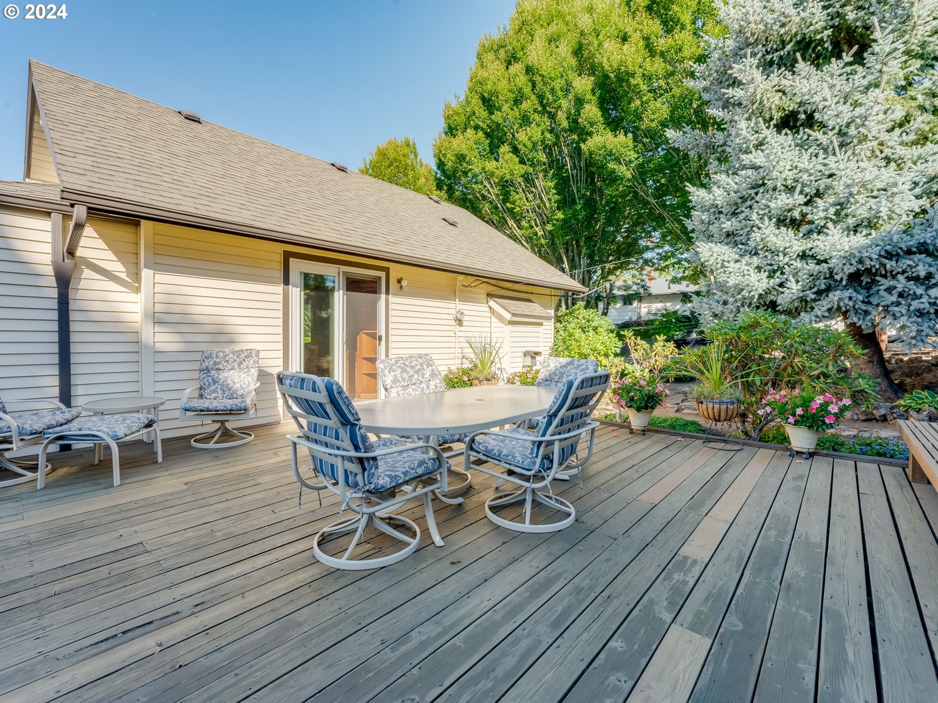 4144 Southeast Ogden Street Portland, OR 97202 - Photo 20 of 27 a view of a roof deck with table and chairs and wooden floor