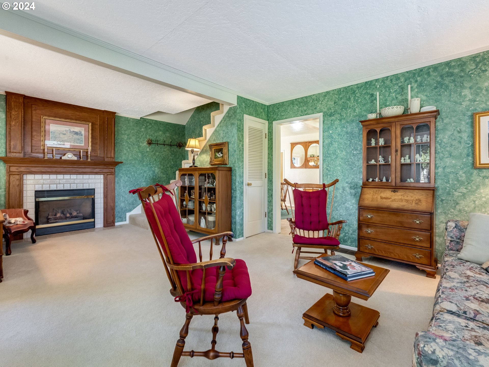 4144 Southeast Ogden Street Portland, OR 97202 - Photo 2 of 27 a living room with furniture a flat screen tv and a fireplace
