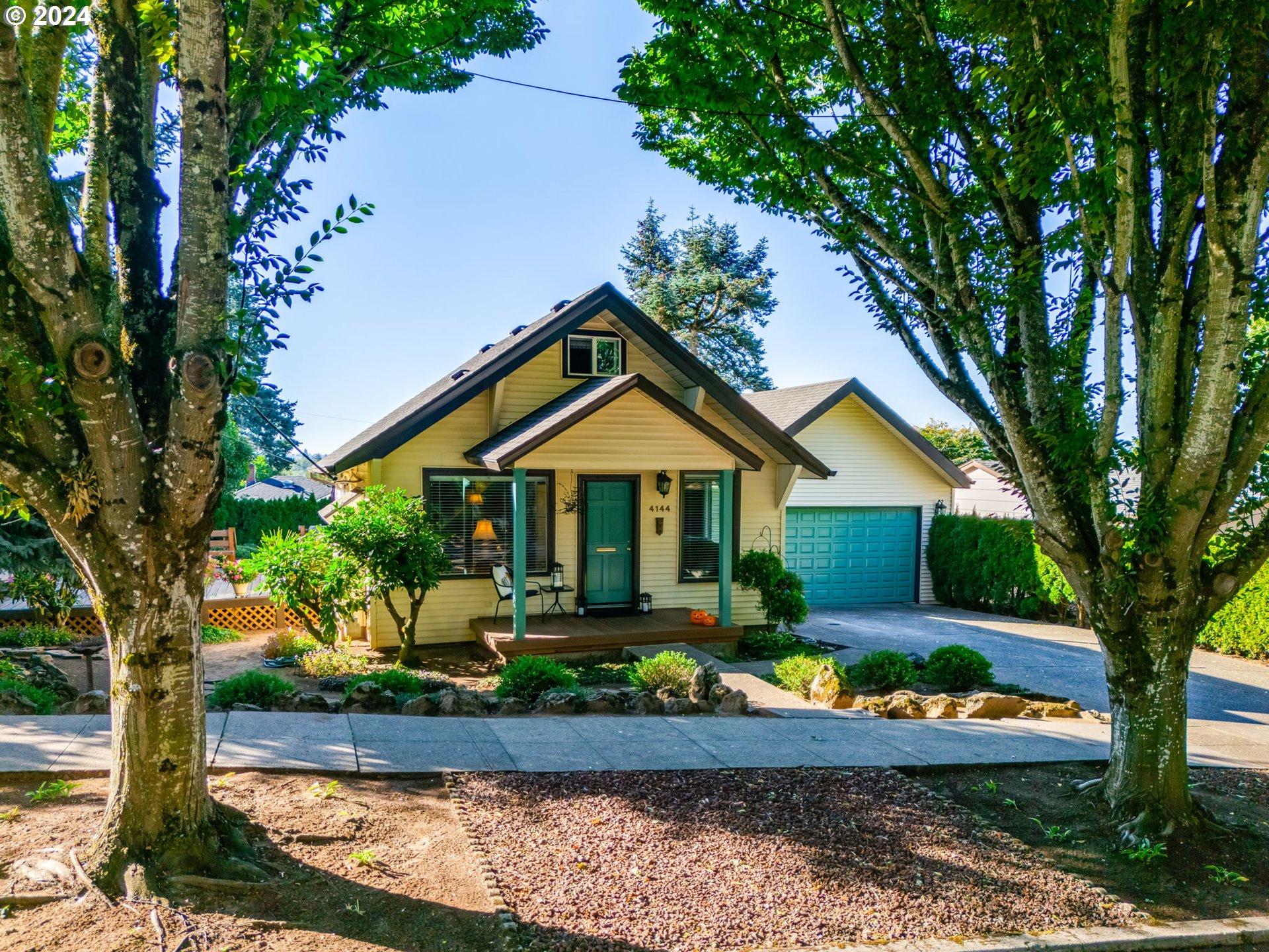 4144 Southeast Ogden Street Portland, OR 97202 - Photo 26 of 27 a front view of a house with garden