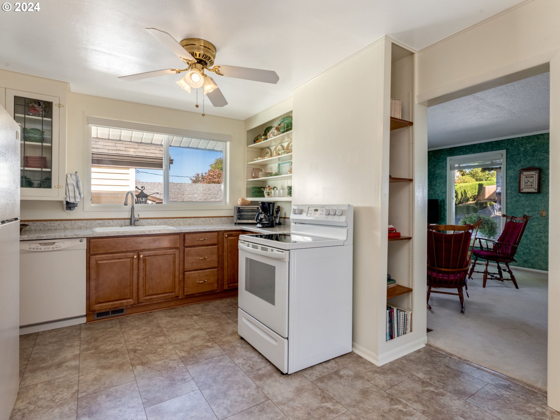 4144 Southeast Ogden Street Portland, OR 97202 - Photo 7 of 27 a kitchen with a sink stove and cabinets