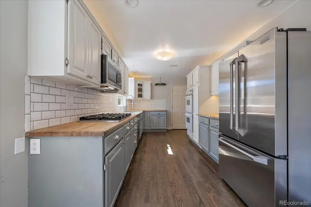 a large kitchen with a large window
