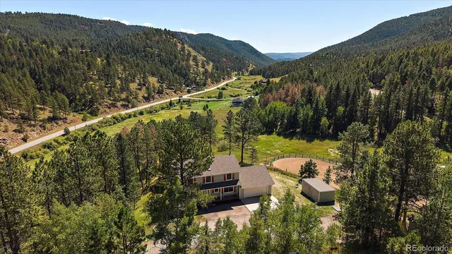 a view of a yard and mountains