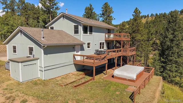 an aerial view of a house with a yard