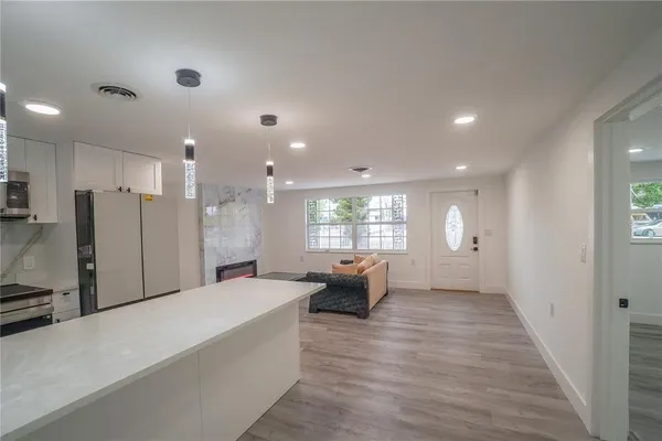 a large white room with a large window
