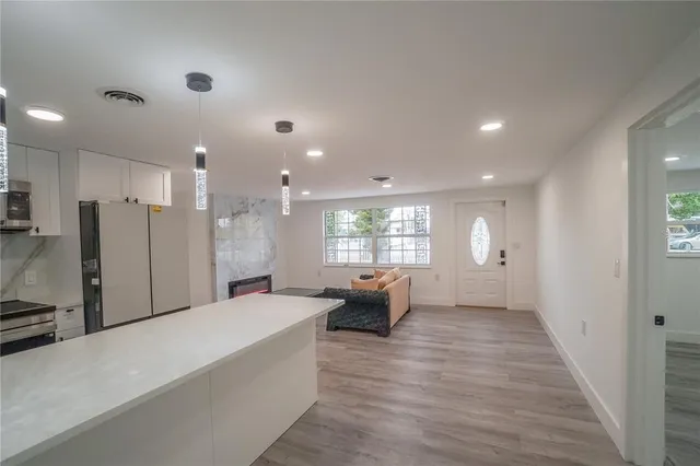 a large white room with a large window