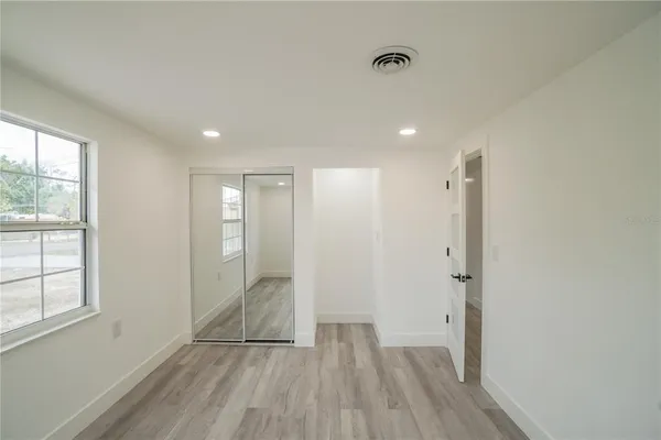 a view of entryway with wooden floor