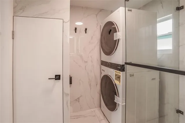 a utility room with dryer and washer