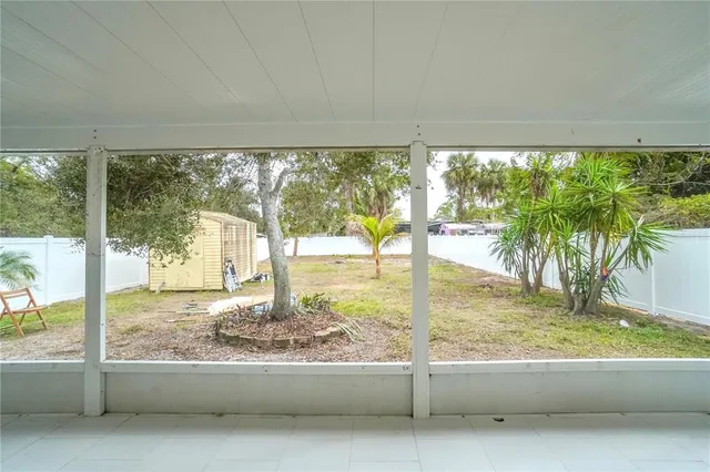 a view of a yard with palm trees