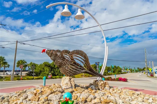 an aerial view of a residential houses with outdoor space
