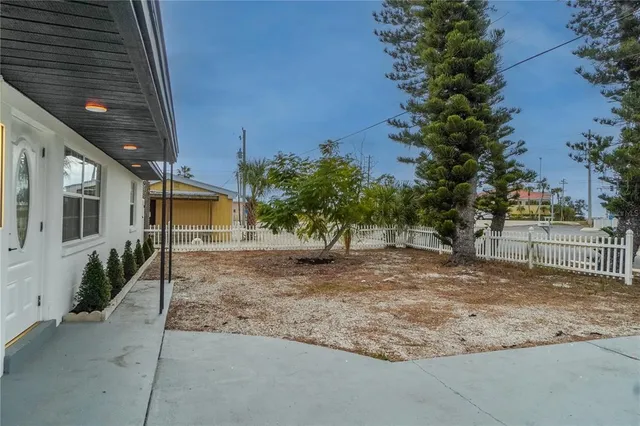 a view of a house with a tree