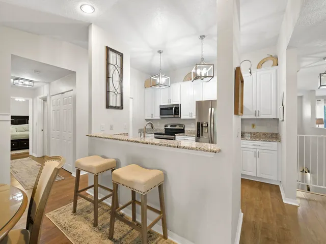 a view of a kitchen from the hallway