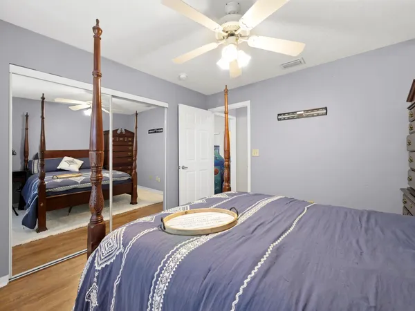a bathroom with a toilet a sink and a mirror