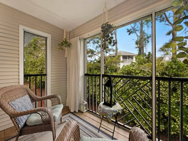 an aerial view of a house with a yard and parking spaces