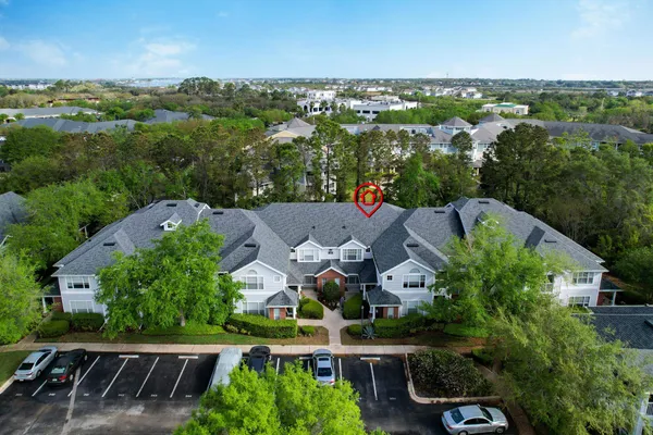a view of a lake with houses in the background